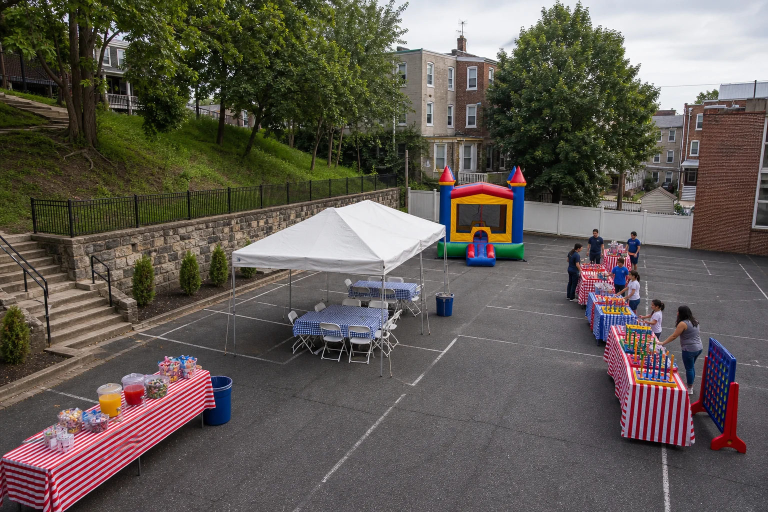 Manayunk and Roxborough slope-aware party layout with tent seating, bounce area, games, snacks, and clear walking lanes